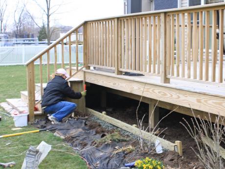 Base plate for deck skirt