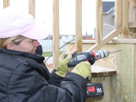 Tricia installing deck skirt boards