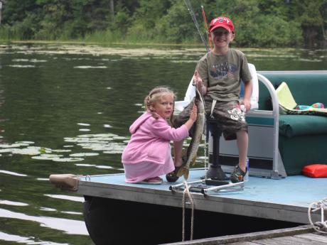 Anna pets a Northern Pike