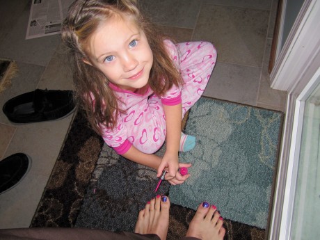Anna gives daddy his first pedicure